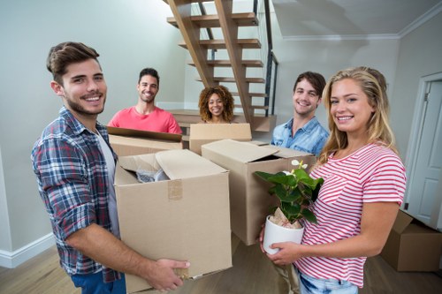 Removal team loading items into a moving van