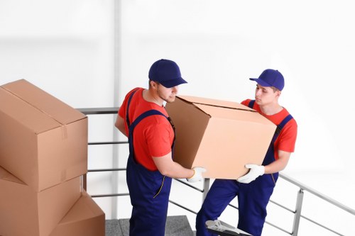 Removal team planning a house move in Ilford with furniture and boxes