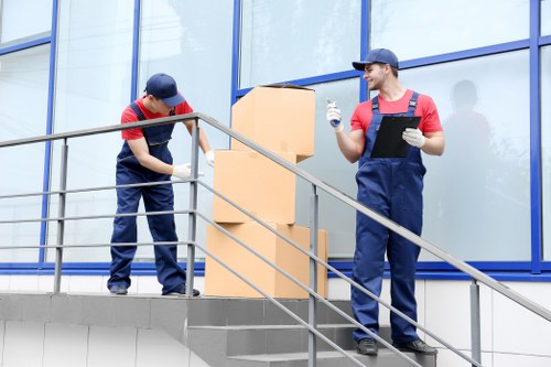 Removal company staff pricing a small flat move in Ilford