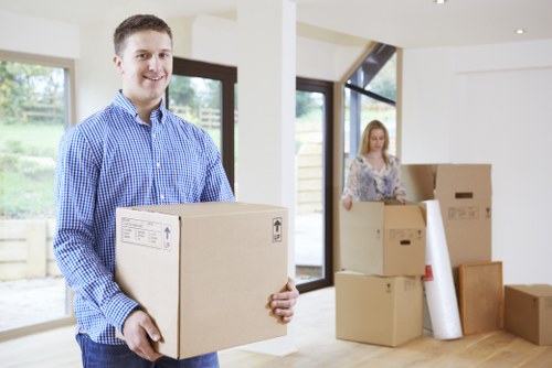 Professional movers loading furniture for an Ilford removal