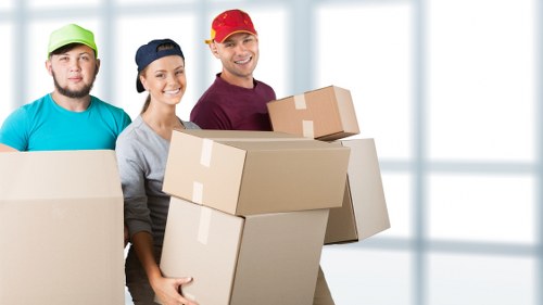 Removal crew loading boxes and furniture for a home move