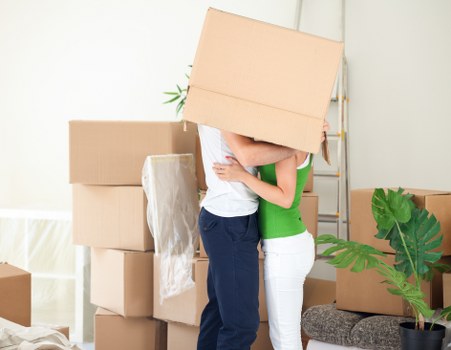 Prepared moving boxes and wrapped furniture for a local flat removal