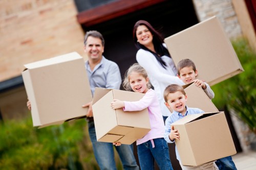 Professional movers handling furniture and boxes in Ilford