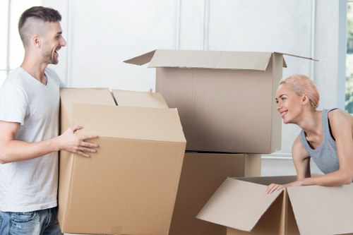 Organised moving boxes and household items ready for transport in Ilford