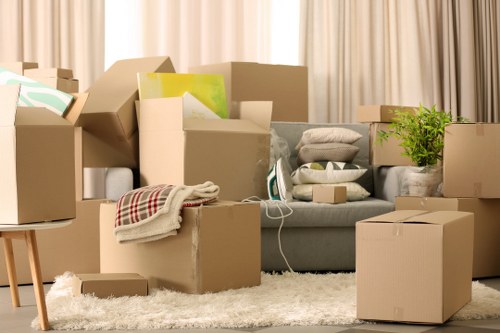Local movers organising fragile household items for transport in Ilford