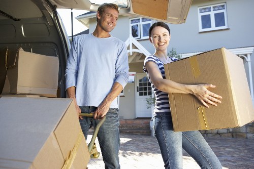 Professional movers handling furniture with care